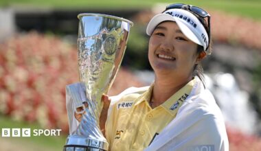 Haeran Ryu lifts the Evian Championship trophy