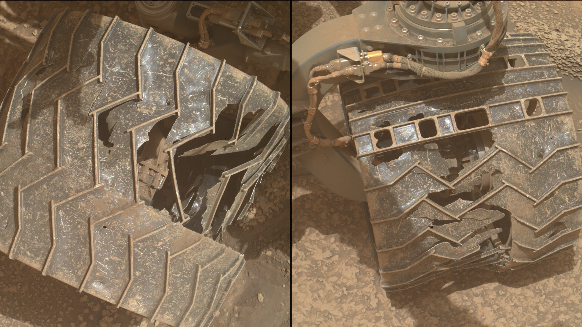 a close-up of a metal wheel with deep cracks and caved-in sections as it rests on a reddish-orange rocky surface