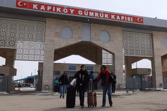 Iranians make their way after crossing into Turkey in Van province, March 3, 2026.