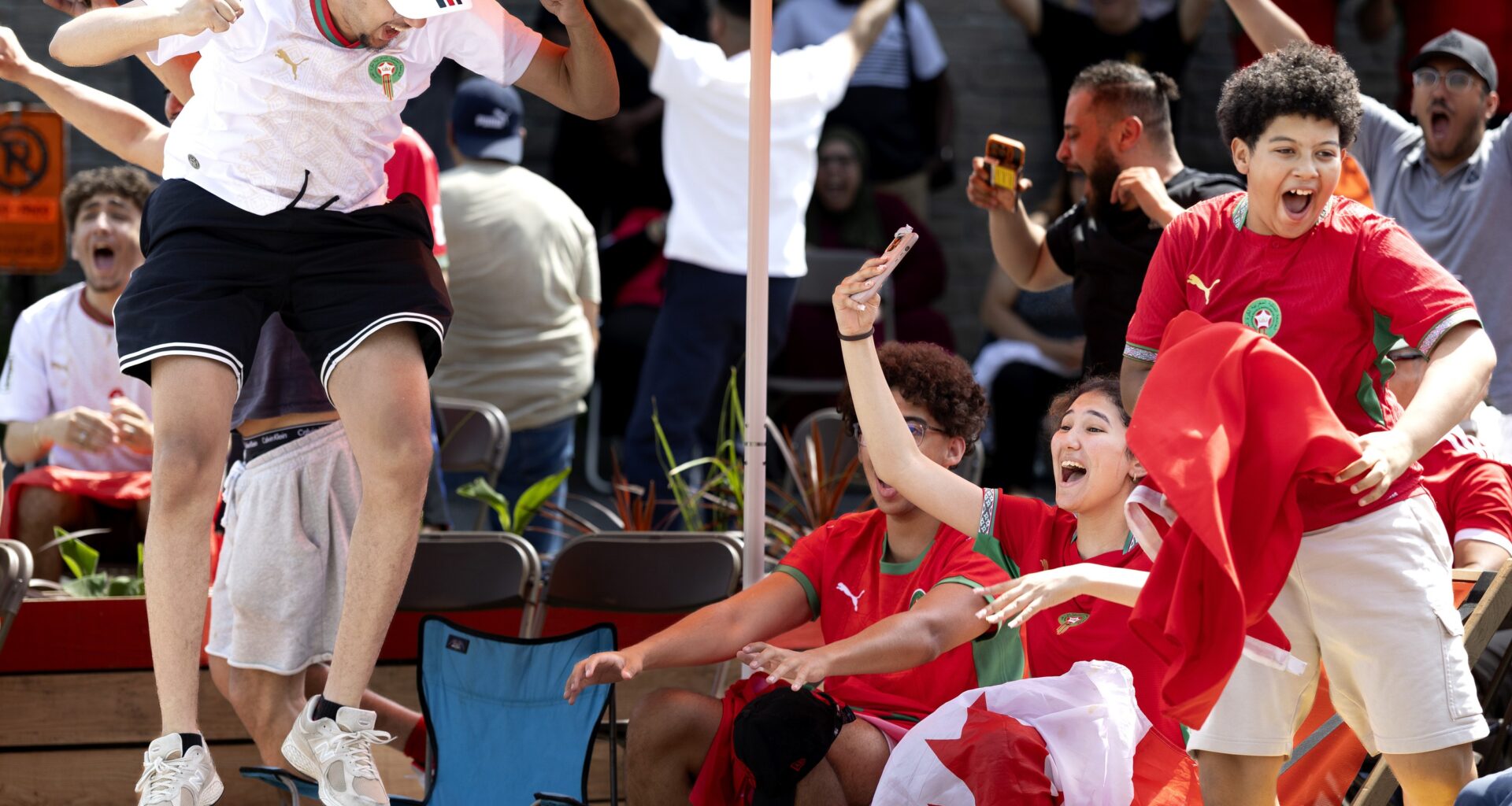 Soccer fans celebrate a World Cup win at in a watch party in Montreal.