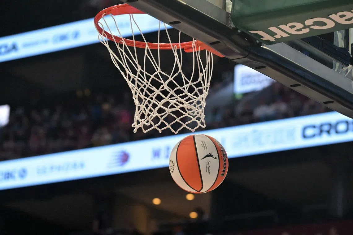 Jul 12, 2026; Montreal, Quebec, CAN; WNBA logo on ball and the net during the first half of a game. Mandatory Credit: Eric Bolte-Imagn Images