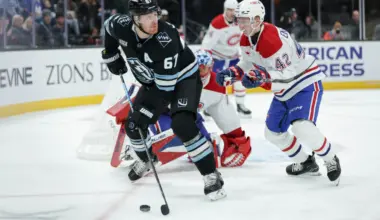 Utah Mammoth left wing Lawson Crouse (67) tries to get the puck away from Montreal Canadiens defenseman Adam Engstrom (42) during the third period at Delta Center.