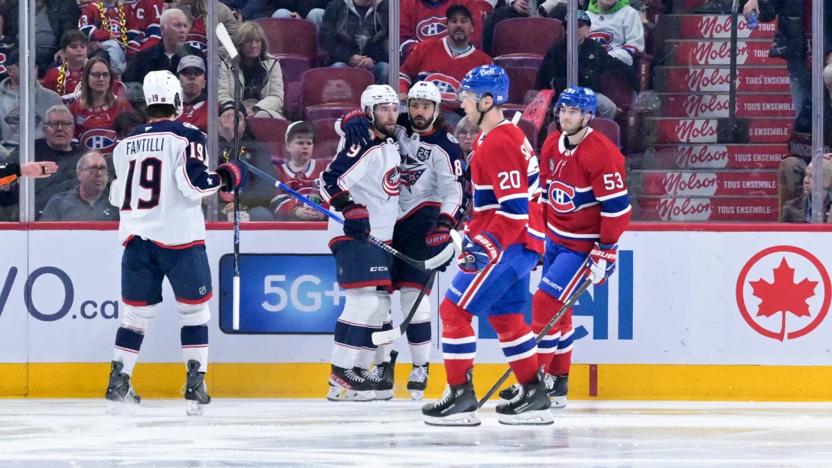 Columbus Blue Jackets forward Kirill Marchenko (86) celebrates with teammates after scoring a goal against the Montreal Canadiens during the second period at the Bell Centre.