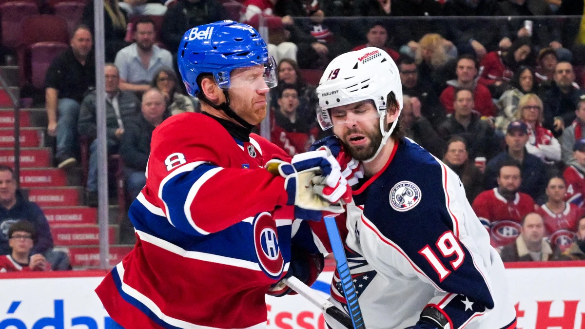 Montreal Canadiens defenseman Mike Matheson (8) punches Columbus Blue Jackets forward Adam Fantilli (19) during the third period at the Bell Centre.