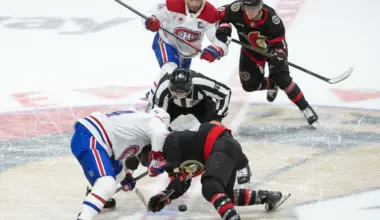 Montreal Canadiens center Phillip Danault (24) faces off against Ottawa Senators right wing Claude Giroux (28) at the start of overtime at the Canadian Tire Centre.