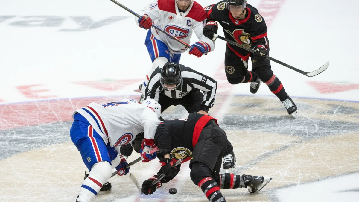 Montreal Canadiens center Phillip Danault (24) faces off against Ottawa Senators right wing Claude Giroux (28) at the start of overtime at the Canadian Tire Centre.
