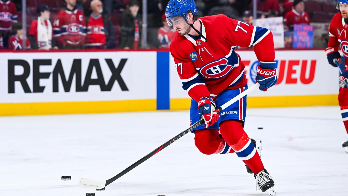 Montreal Canadiens center Kirby Dach (77) skates with a puck during warm-up before the game against the New York Islanders at Bell Centre.