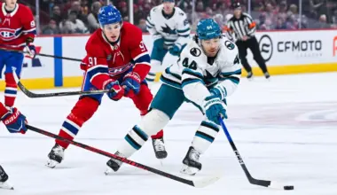 San Jose Sharks left wing Kiefer Sherwood (44) plays the puck against Montreal Canadiens center Oliver Kapanen (91) during the first period at Bell Centre.