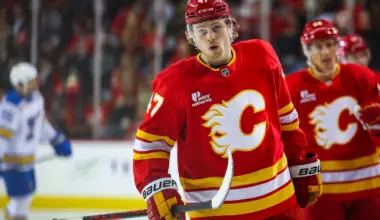 Calgary Flames center Connor Zary (47) celebrates his goal with teammates against the St. Louis Blues during the first period at Scotiabank Saddledome.