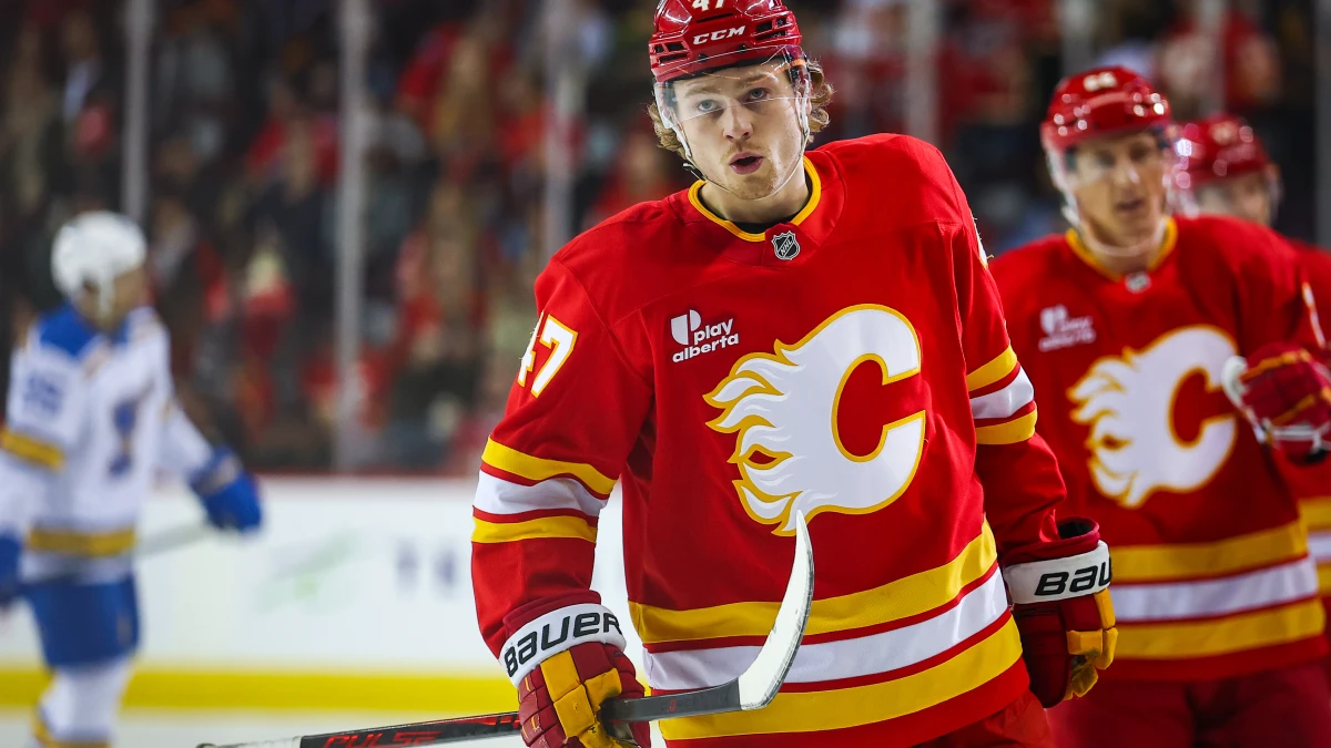 Calgary Flames center Connor Zary (47) celebrates his goal with teammates against the St. Louis Blues during the first period at Scotiabank Saddledome.