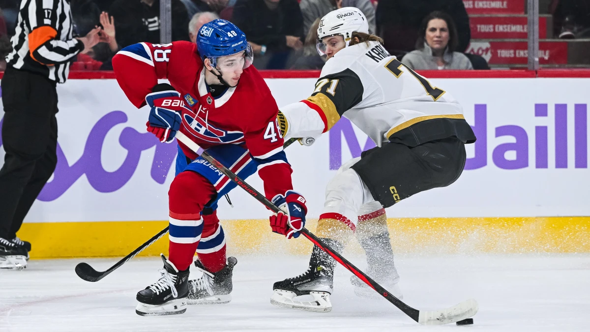 Montreal Canadiens defenseman Lane Hutson (48) defends the puck against Las Vegas Golden Knights center William Karlsson (71) during the first period at Bell Centre.