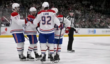 Montreal Canadiens center Alex Newhook (15) and left wing Patrik Laine (92) and defenseman Lane Hutson (48) and center Kirby Dach (77) celebrates a goal scored Newhook against the Dallas Stars during the third period at the American Airlines Center.