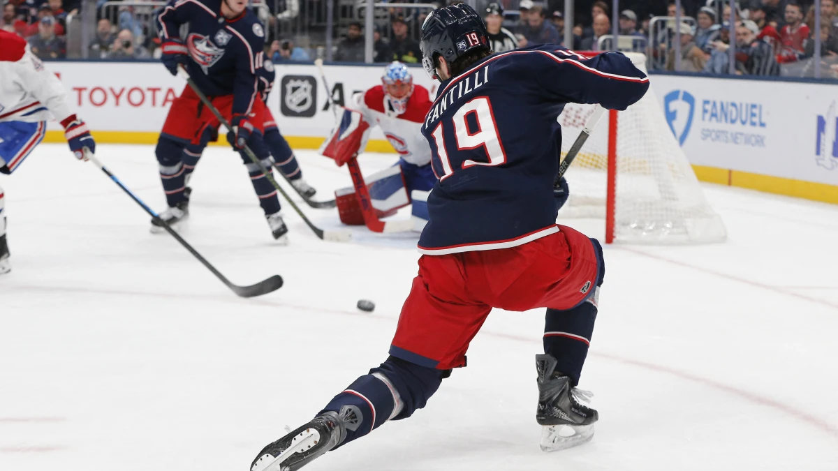 Columbus Blue Jackets center Adam Fantilli (19) wrists a shot on goal against the Montreal Canadiens during the second period at Nationwide Arena.