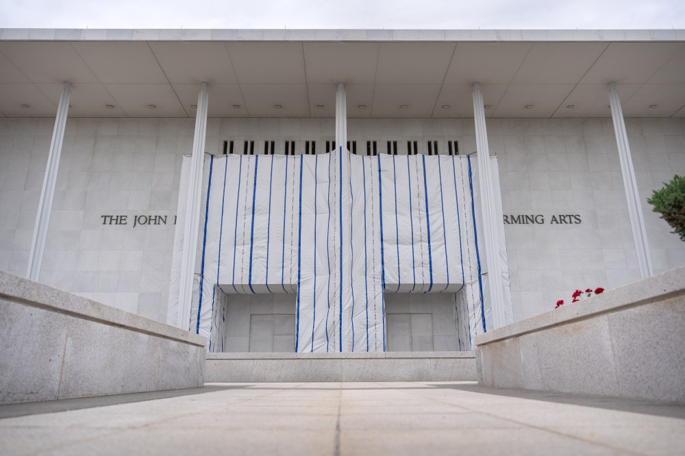 The John F. Kennedy Center for the Performing Arts is seen, as its sign remains covered by a tarp, Friday, June 19, 2026, in Washington. (AP Photo/Mark Schiefelbein)