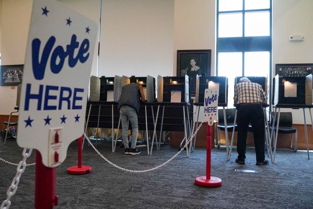 People vote in the Democratic primaries at Blair-Caldwell Library, Tuesday, June 30, 2026, in Denver. (AP Photo/Rebecca Slezak)