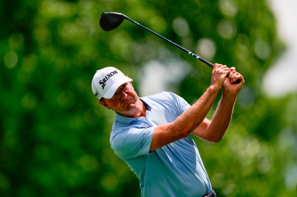 Lucas Glover hits on the 18th tee during first round of the Truist Championship golf tournament at the Quail Hollow Club, Thursday, May 7, 2026, in Charlotte, N.C. (AP Photo/Chris Carlson)