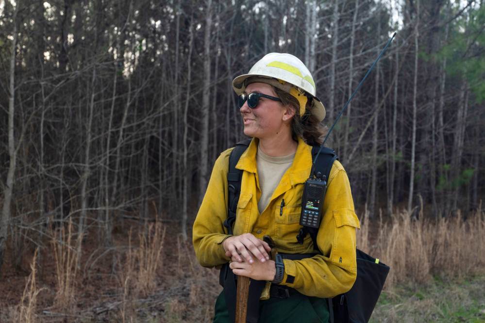 This photo provided by Holly Tuckett shows wildland firefighter Sydney Watson at the North Carolina WRTEX event near Singletary Lake, N.C., on Feb. 27, 2023. (Holly Tuckett via AP)