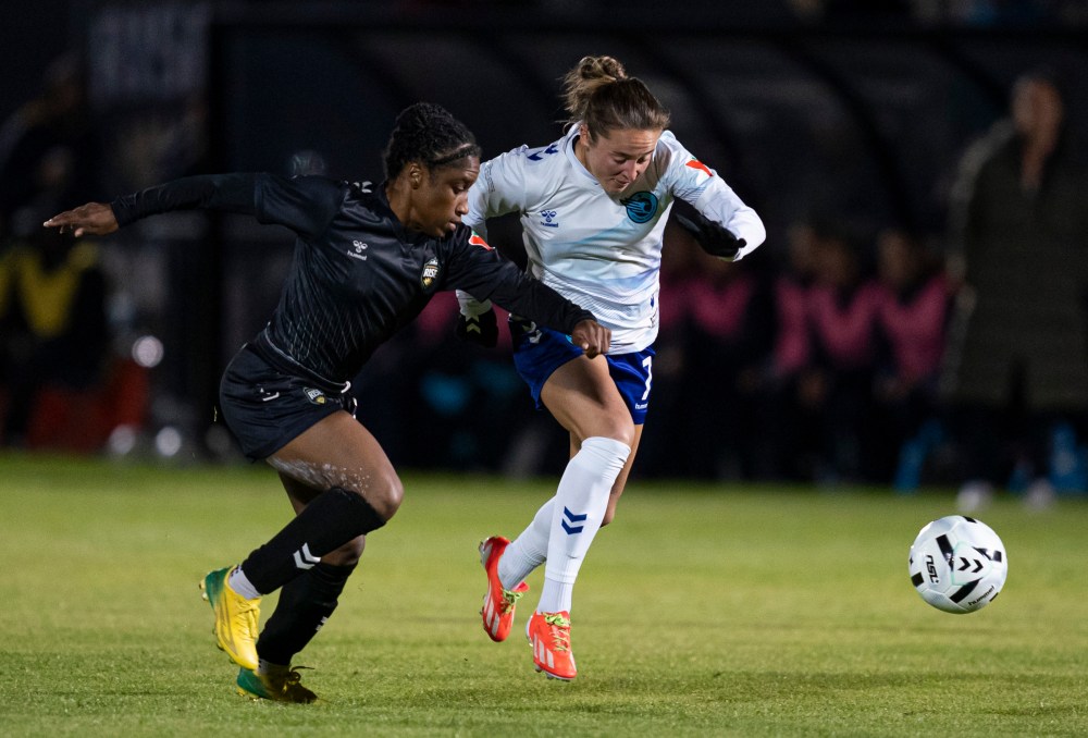 Ottawa Rapid FC's Johanne Fridlund (right) and Vancouver Rise's Jasmyne Spencer chase after a loose ball during the second half of an NSL semifinal soccer match, in Burnaby, B.C., on Tuesday, Nov. 4, 2025. THE CANADIAN PRESS/Rich Lam