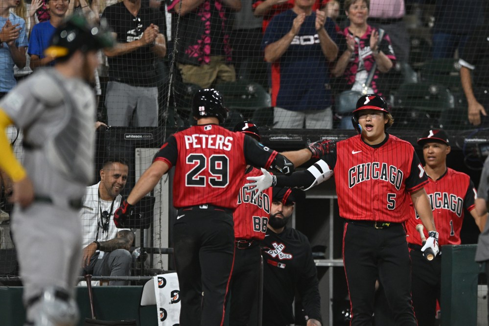 Chicago White Sox's Tristan Peters (29) celebrates with teammate Munetaka Murakami (5) at the dugout after hitting a two-run home run during the seventh inning of a baseball game against The Athletics in Chicago, Friday, July 10, 2026. (AP Photo/Paul Beaty)