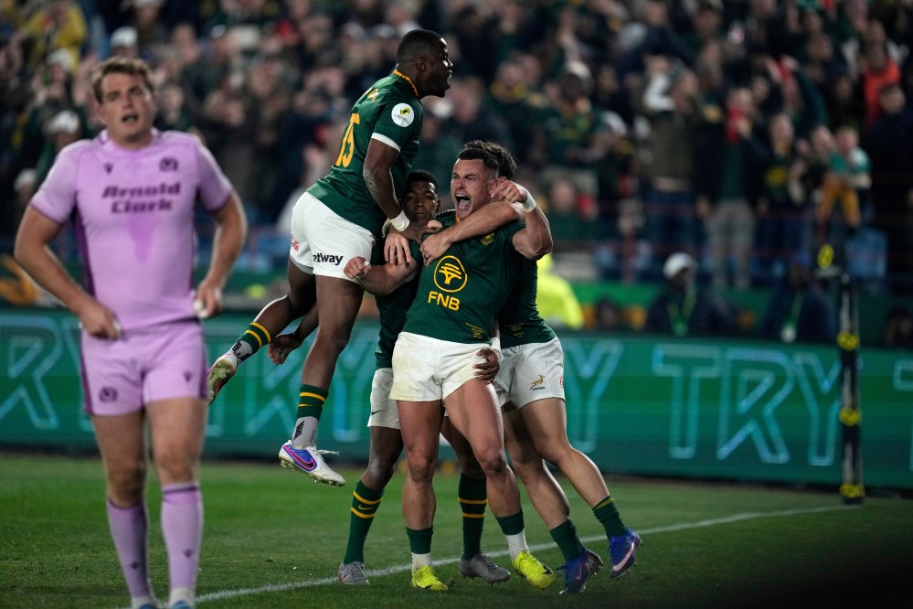 South Africa's Jesse Kriel, center, celebrates with his teammates after scoring a try during the Nations Championship Test rugby match between South Africa and Scotland, in Pretoria, Saturday, July 11, 2026. (AP Photo/Themba Hadebe)