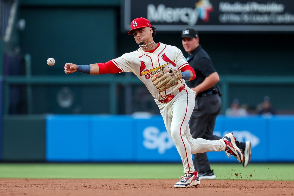 St. Louis Cardinals' Masyn Winn throws to first base for an out against Atlanta Braves' Michael Harris II during the third inning of a baseball game Saturday, July 11, 2026, in St. Louis. (AP Photo/Scott Kane)