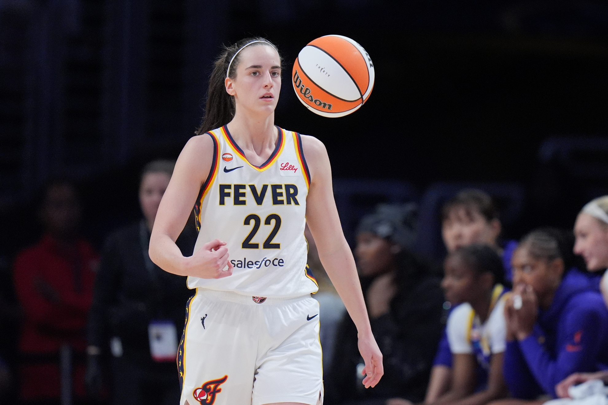 Indiana Fever guard Caitlin Clark (22) tosses the ball during a WNBA game against the Los Angeles Sparks