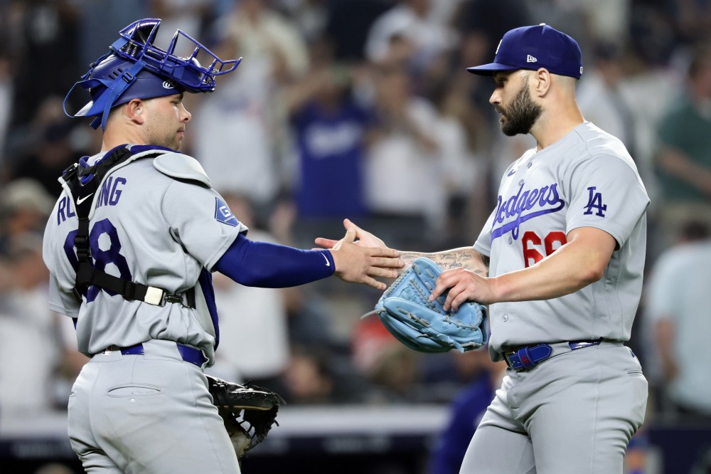 Los Angeles Dodgers pitcher Tanner Scott (66) celebrates with catcher Dalton Rushing (68) after defeating the New York Yankees in a baseball game Friday, July 17, 2026, in New York. (AP Photo/Adam Hunger)