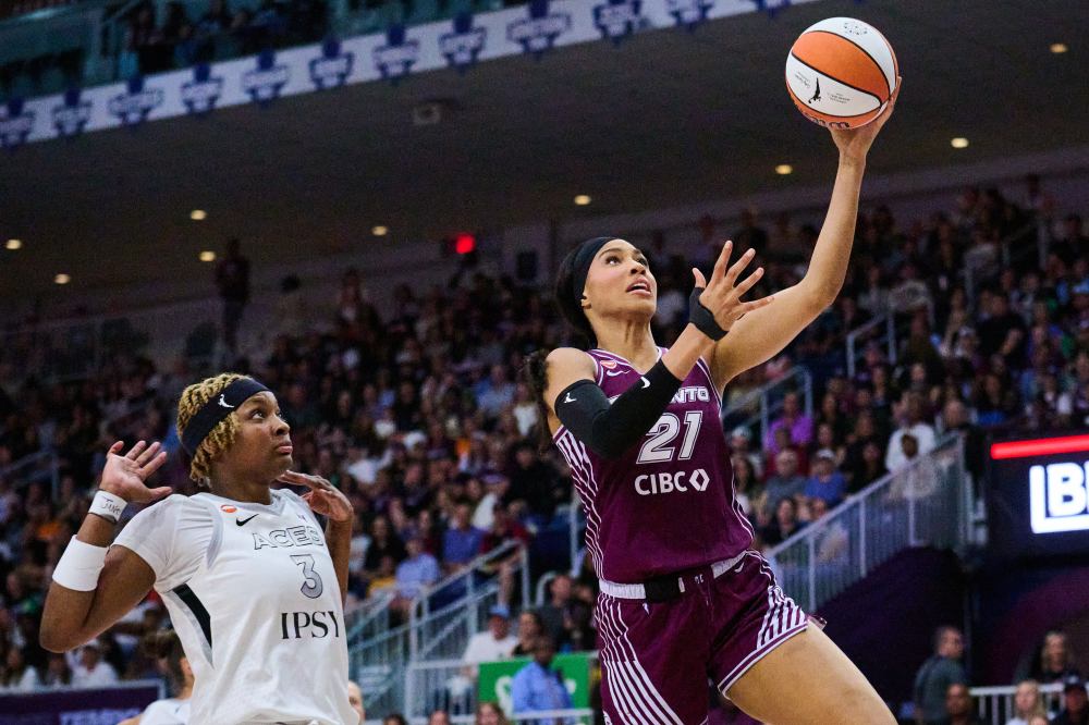 Toronto Tempo's Isabelle Harrison (21) drives past Las Vegas Aces' NaLyssa Smith (3) during first half WNBA basketball action in Toronto, on Monday, July 20, 2026. THE CANADIAN PRESS/Sammy Kogan