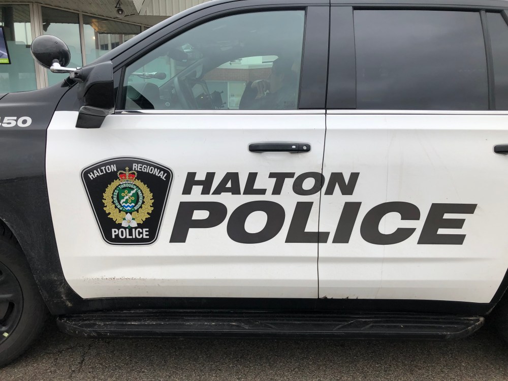 A Halton Regional Police vehicle is shown in Oakville, Ont., Wednesday, Jan. 18, 2023. Halton Regional police say they have arrested a woman alleged to have thrown an unknown chemical on her family member and stolen her phone last week in Milton, Ont. THE CANADIAN PRESS/Richard Buchan