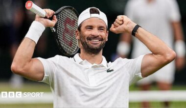 Grigor Dimitrov holds up his arms