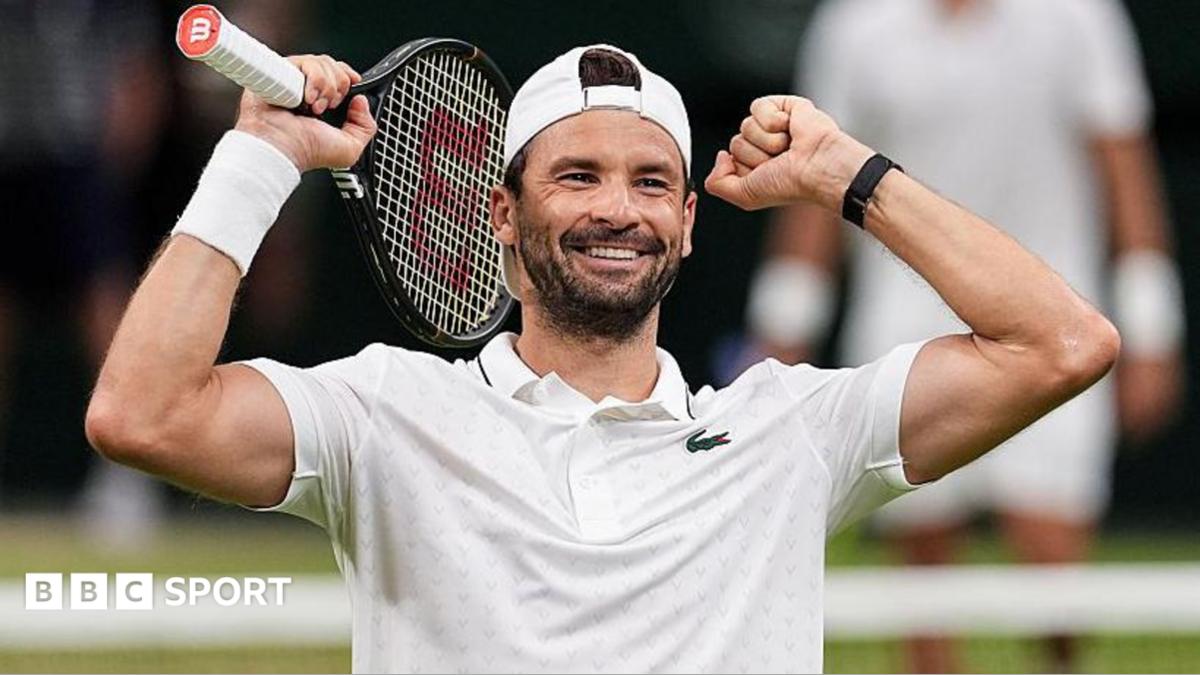 Grigor Dimitrov holds up his arms