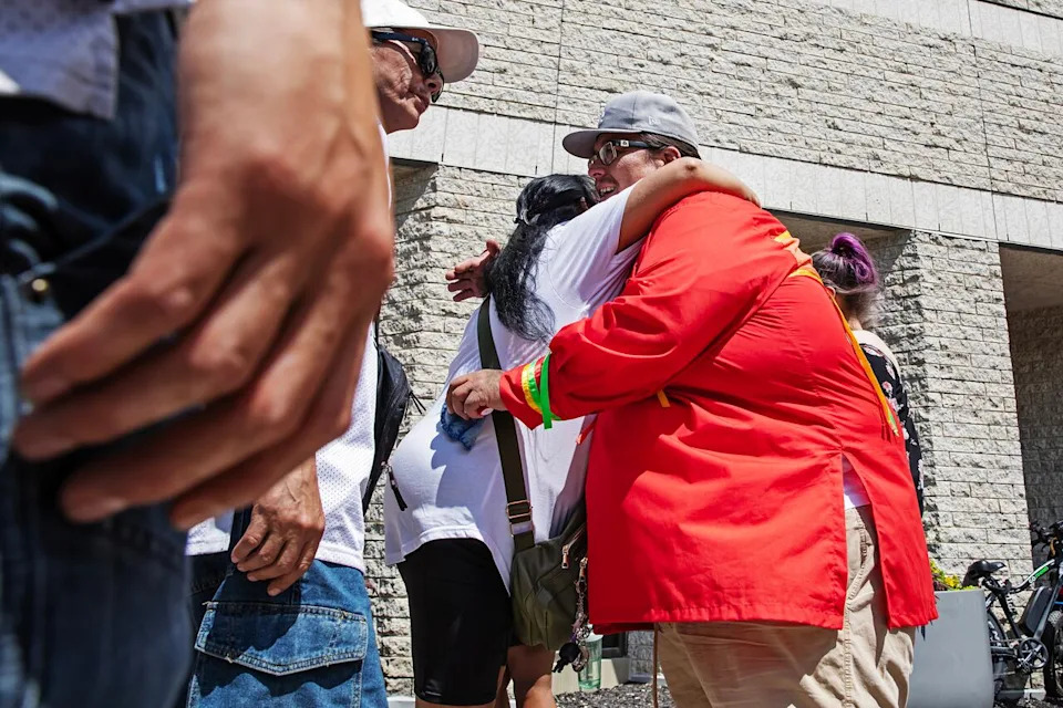 Norman Lagimodiere, father of Kiana Everett, hugs someone at a rally outside Winnipeg Remand Centre on Monday, July 6, 2026, for his daughter Kiana Everett. She died in custody July 1.
