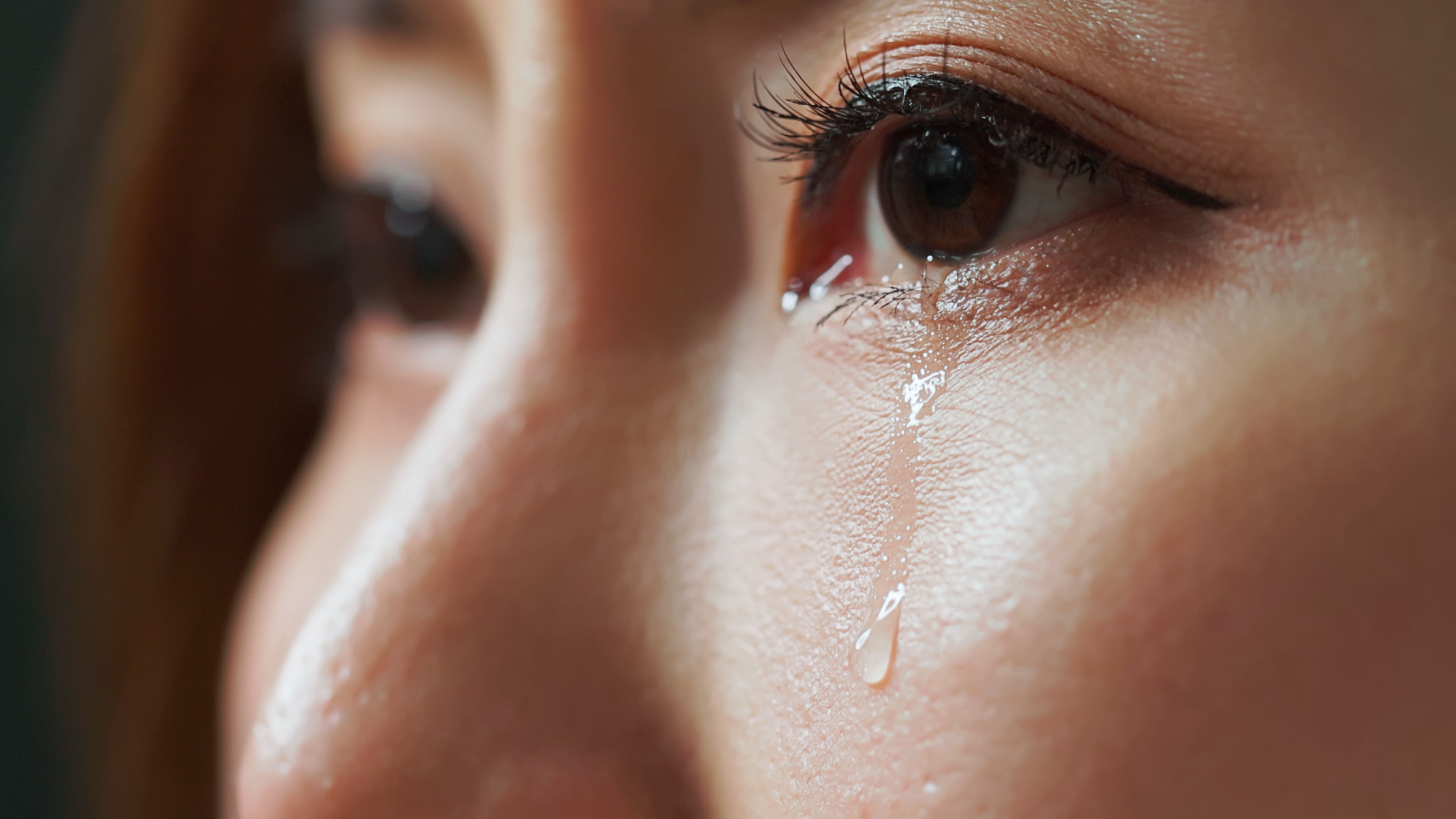 Asian woman crying.