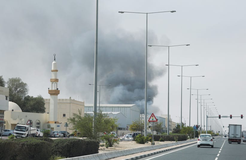 [FILE PHOTO] Smoke Rises after reported Iranian missile attacks, as seen from Doha, Qatar, March 1.
