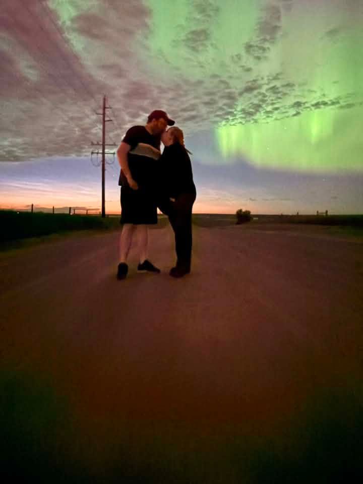 A vivid display of green northern lights illuminates the sky above a rural road near Medicine Hat shortly before midnight on July 3. Photo Teri-lyn Kniivila