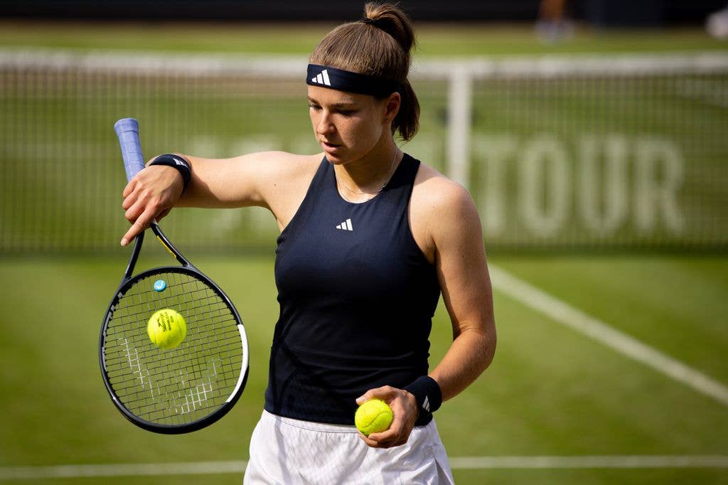Karolina Muchova with a tennis racket
