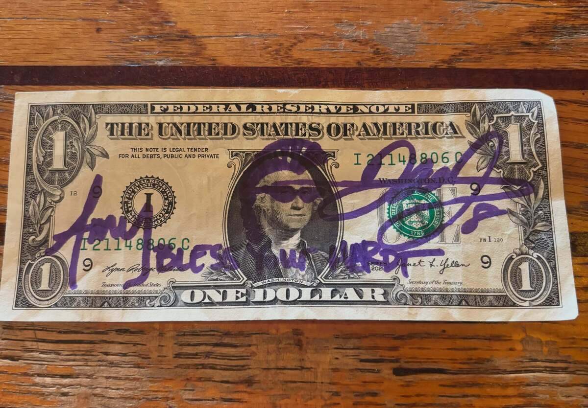 Dale Earnhardt Jr. and his wife, Amy, signed this dollar bill at the Fillin’ Station on Lady’s Island.