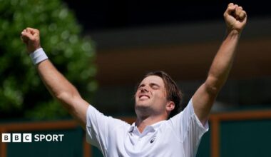 Arthur Fery covers his face as he celebrates winning at Wimbledon