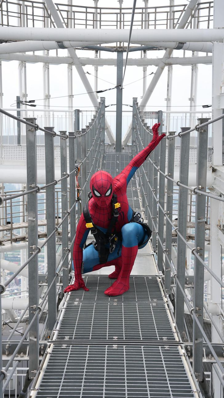 An actor dressed as Spider-Man explores themed photo zones and takes on the Sky Bridge Tour atop Lotte World Tower in Seoul to promote Sony Pictures’ “Spider-Man: Brand New Day.” Courtesy of Lotte World