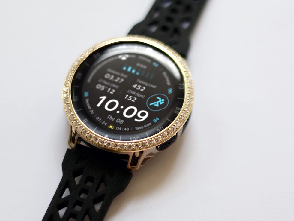 Stylish black smartwatch with a round face displaying the time and fitness metrics. Stylish black smartwatch with a round face displaying the time and fitness metrics.