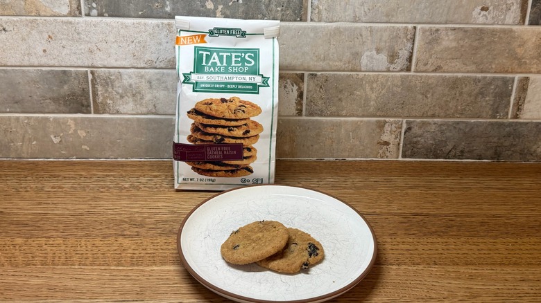 Tate's Oatmeal Raisin Cookies box with two cookies on a plate