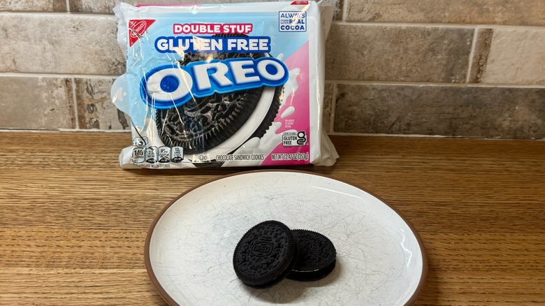 Double Stuff Gluten-Free Oreo pack with two cookies displayed on a white plate