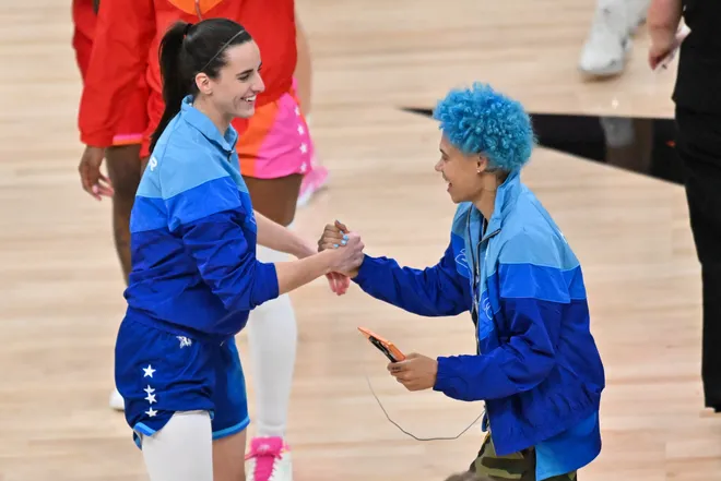 Jul 25, 2026; Chicago, Illinois, USA; Team Spoon guard Caitlin Clark (22) shakes hands with Seattle Storm guard Natisha Hiedeman (2) before the start of the 2026 WNBA All-Star Game at the United Center. Mandatory Credit: Patrick Gorski-Imagn Images