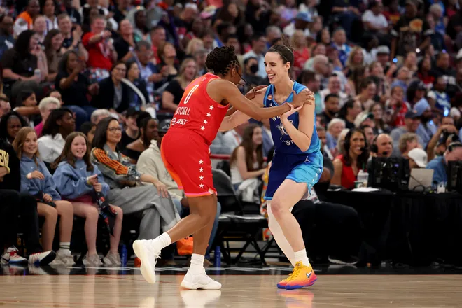 CHICAGO, ILLINOIS - JULY 25: Caitlin Clark #22 of Team Spoon celebrates with Kelsey Mitchell #0 of Team Coop during the first half in the 2026 AT & T WNBA All-Star Game at the United Center on July 25, 2026, in Chicago, Illinois. NOTE TO USER: User expressly acknowledges and agrees that, by downloading and/or using this photograph, User is consenting to the terms and conditions of the Getty Images License Agreement. (Photo by Geoff Stellfox/Getty Images)