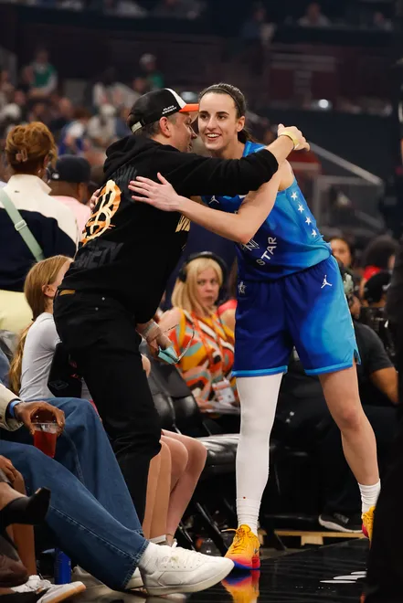 Jul 25, 2026; Chicago, Illinois, USA; Team Spoon guard Caitlin Clark (22) greets Actor Jason Sudeikis in the second half against Team Coop during the 2026 WNBA All-Star Game at the United Center. Mandatory Credit: Kamil Krzaczynski-Imagn Images