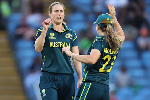 Ellyse Perry celebrates the wicket of Aliya Riaz of Pakistan with teammate Sophie Molineux during their T20 World Cup group match at Headingley.