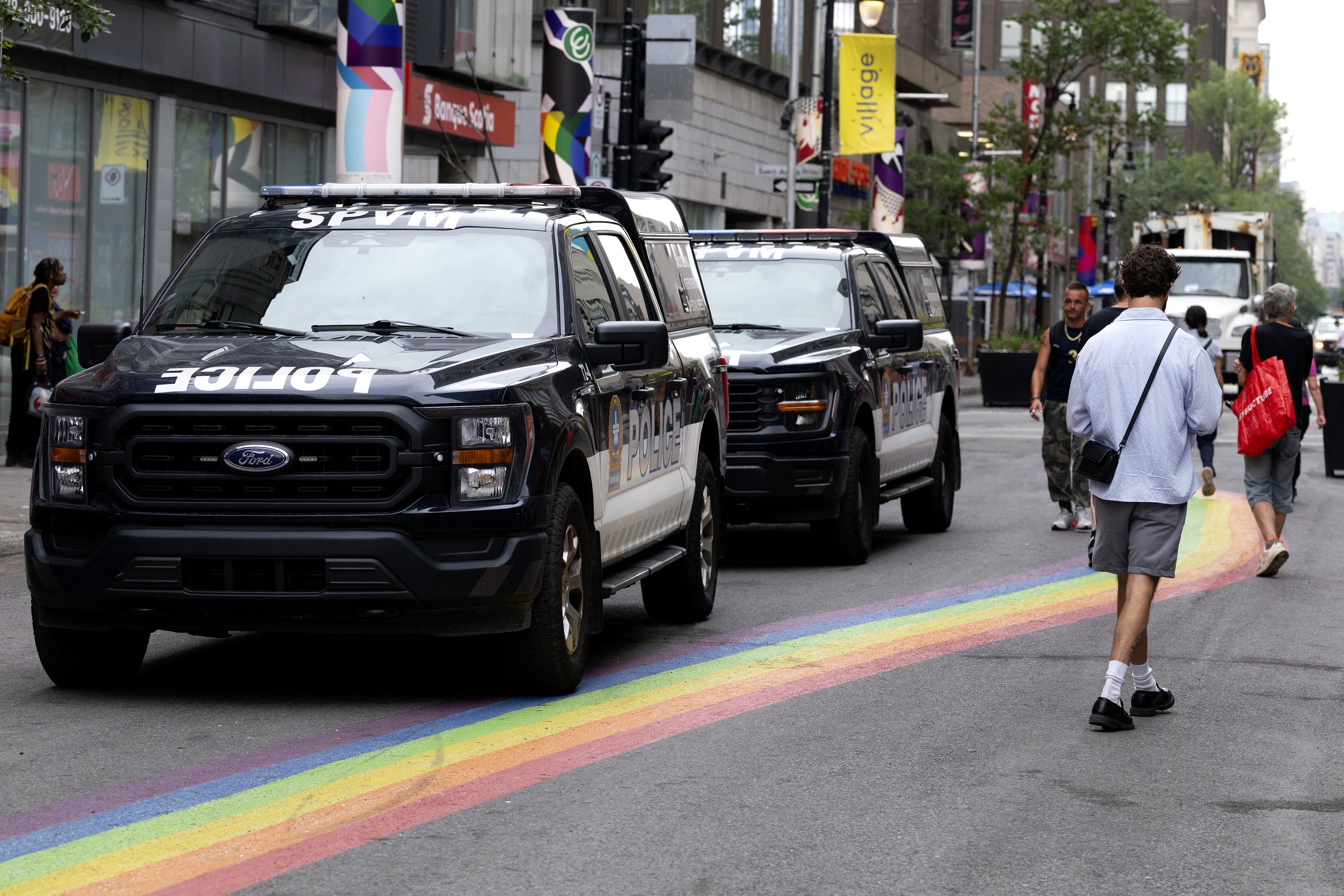 Montreal police cars parked on street in Montreal's Village.