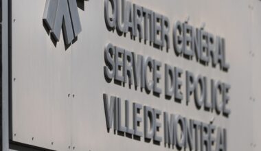 The Montreal police, SPVM logo on the wall of the headquarters building in Montreal.
