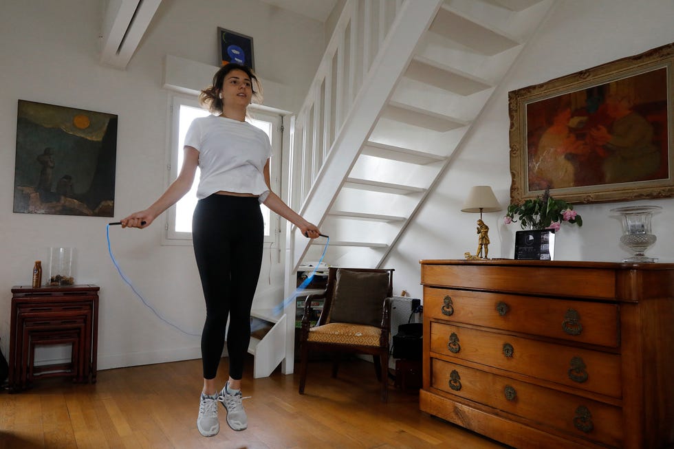 vo2 max home workouts: woman skipping inside at home