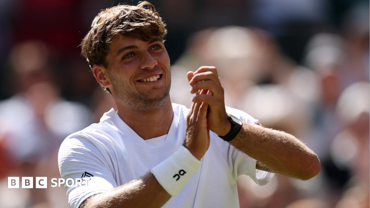 Flavio Cobolli applauds the Wimbledon crowd after his win over Alex de Minaur